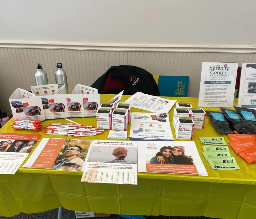 A table full of Better Life Partners flyers