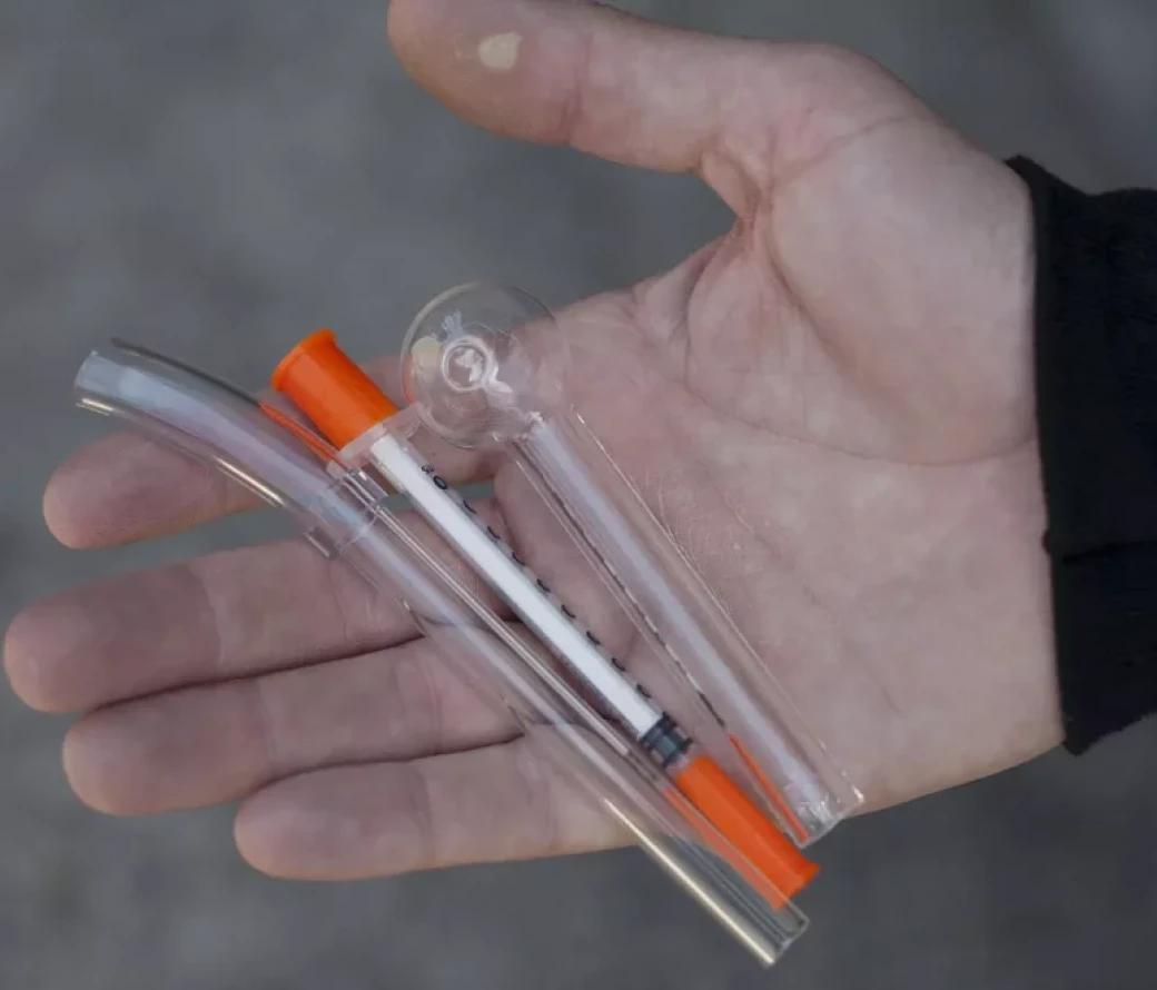 Hand holding opioid use paraphernalia