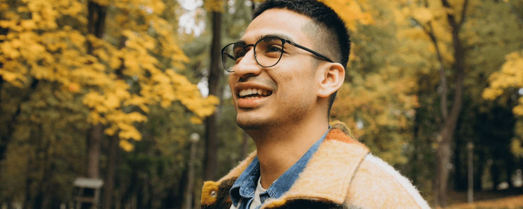 man with glasses smiling