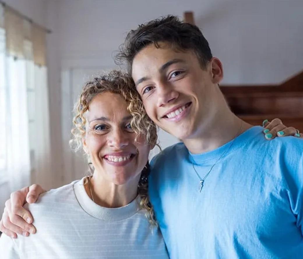 Woman and son smiling at the camera