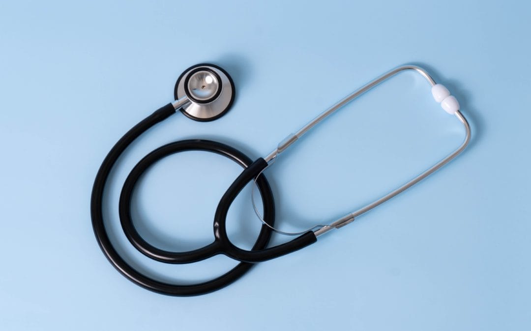 Stethoscope on blue background